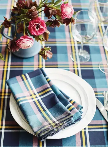  ?? PHOTOS: POSTMEDIA ?? Plaids and checks are trending this fall/winter in home design, says designer Samantha Pynn, who rejoices in the soaring popularity of the pattern, which she celebrates in her new collection.