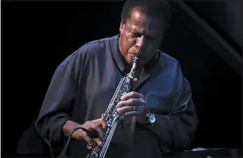  ?? CHAD BATKA — NEW YORK TIMES FILE ?? Wayne Shorter plays with his quartet at Town Hall in New York in 2011. Shorter formed Weather Report in 1971. Its most commercial­ly successful edition, featuring electric bass phenom Jaco Pastorius, became an arena attraction.