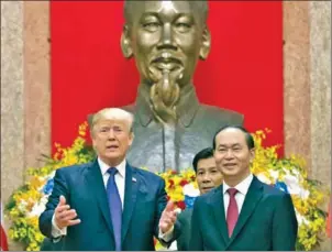  ?? JIM WATSON/AFP ?? Vietnamese President Tran Dai Quang (right) meets US President Donald Trump after attending the Apec Summit in Danang, Vietnam, in November last year.