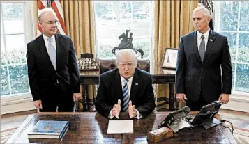  ?? OLIVIER DOULIERY/GETTY ?? President Donald Trump, with Health Secretary Tom Price and Vice President Mike Pence, talks about the health bill.