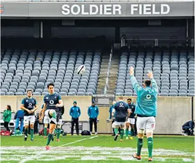  ??  ?? New world: Joey Carbery practises his kicking at Soldier Field yesterday