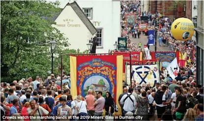  ?? ?? Crowds watch the marching bands at the 2019 Miners’ Gala in Durham city