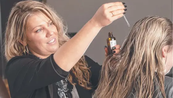  ?? Picture: Nev Madsen ?? HAIR CARE: Hairdresse­r Samantha Moir has started a second business Moir Organics, with a focus on natural, organic and conscious cleaning, hair and skin care products.