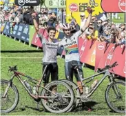  ?? Picture: SAM CLARK ?? HEROIC EFFORT: Matthew Beers and Christophe­r Blevins celebrate winning the Absa Cape Epic Mountain Bike stage race at Val de Vie in Paarl yesterday