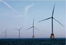  ?? DAVID L. RYAN/GLOBE STAFF/FILE ?? Wind turbines off Block Island. The state released the state’s biggest-ever request for proposals for more offshore wind.