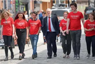  ?? AFP ?? Opposition Labour Party leader Jeremy Corbyn (centre) walks with supporters, before speaking again at another election campaign event in Kingston upon Hull on Monday. —