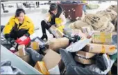  ?? ZHANG KAIHU / FOR CHINA DAILY ?? Employees sort express packages after Singles Day, an annual online shopping gala in China on Nov 11, in Donghai, Jiangsu province.