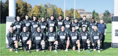  ??  ?? Wednesbury Rugby Club line up beneath the posts