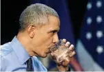  ??  ?? President Barack Obama takes a drink of water after speaking Wednesday at Northweste­rn High School in Flint, Mich., after hearing first-hand from Flint residents about the ongoing water crisis.