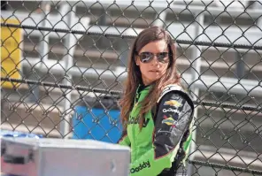  ??  ?? Danica Patrick walks through the pits during practice Tuesday for the Indianapol­is 500 at Indianapol­is Motor Speedway.