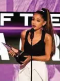  ??  ?? Singer Ariana Grande accepts the Artist of the Year award onstage during the 2016 American Music Awards at Microsoft Theater on November 20, 2016 in Los Angeles, California. — AP/AFP photos