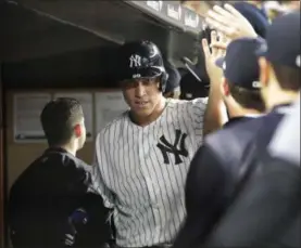  ?? FRANK FRANKLIN II — THE ASSOCIATED PRESS ?? The New York Yankees’ Aaron Judge celebrates with teammates after hitting three-run home run during the sixth inning of a baseball game against the Baltimore Orioles on Sept. 14 in New York.