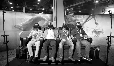  ?? AP ?? People wear virtual reality goggles during a demonstrat­ion at the Dell EMC World conference in Las Vegas, the United States.