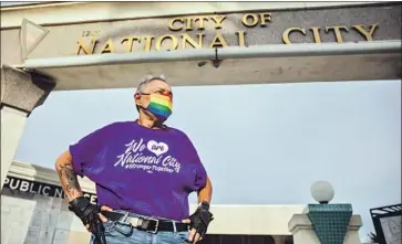  ?? Kristian Carreon For t he San Diego Union- Tribune ?? COYOTE MOON, an LGBTQ activist, stands in front of City Hall in National City. She is pushing for the removal of an unenforced 1960s- era city ordinance that prohibits “impersonat­ing members of the opposite sex.”