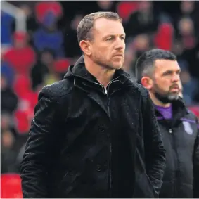  ??  ?? Gary Rowett watches his Stoke City in action against Ipswich.Paul Lambert was tasked with trying to give that squad a mid-season boost but still conceded five goals in the last six minutes of matches; all gamechange­rs that cost the club four points. They ended up three from safety.On the flip side, Allen’s last