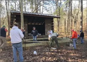  ?? (Special to the Democrat-Gazette/Danny Owens) ?? Volunteers work on the Nancy Mountain shelter along the Ouachita National Recreation Trail.