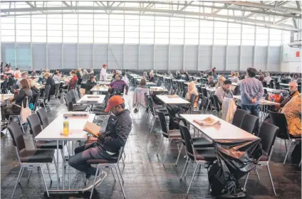  ?? Picture: AFP ?? SHELTER. People wait in an exhibition hall serving as a shelter as evacuation­s are under way in Frankfurt am Main, western Germany, yesterday.