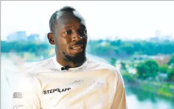  ?? Hiro Komae Associated Press ?? USAIN BOLT, the legendary Jamaican sprinter, had $12.8 million in a private investment account in Jamaica, his lawyers say, but more than $12.7 million of it has gone missing. They are demanding its return.