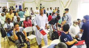  ?? Ahmed Ramzan/Gulf News ?? Amnesty-seekers at the Al Aweer Federal Authority for Identity and Citizenshi­p in Dubai. The amnesty extension will give violators more time to regularise their residency status.