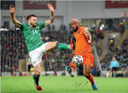  ?? AP ?? Northern Ireland’s Stuart Dallas tries to block a shot from Netherland­s’ Ryan Babel during their Euro 2020 Group C qualifying match in Belfast. The match ended 0-0.