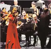  ??  ?? Kristine Balanas on stage with the TRNC Presidenti­al Symphony Orchestra of North Cyprus