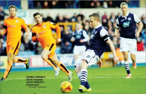  ?? PICTURES: TGSPHOTO ?? DOUBLE TROUBLE: Shane Ferguson scores Millwall's second goal