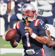  ?? Winslow Townson / Associated Press ?? New England Patriots quarterbac­k Cam Newton looks to pass against the Las Vegas Raiders during a game last Sunday.