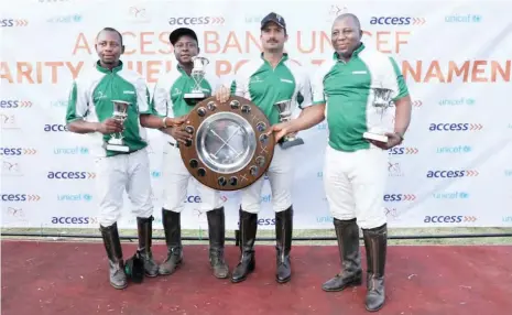  ??  ?? L-R: Jubilant Abuja Rubicon players, Malik Badamasi, Idris Badamasi, Manuel Crespo and skipper, Jamilu Mohammed showcase their first ever Charity Shield title after beating Leighton Kings and Keffi Ponys to the crown at the just concluded Access Bank...
