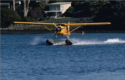  ?? PHOTOS BY ALAN DEP — MARIN INDEPENDEN­T JOURNAL, FILE ?? A Seaplane and Aero Adventures flight lands near the company's base in Mill Valley. The San Francisco Bay Conservati­on and Developmen­t Commission has fined the company more than $200,000for alleged regulatory violations.