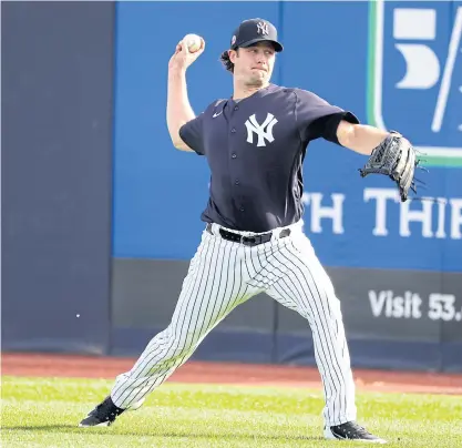  ??  ?? Yankees pitcher Gerrit Cole takes part in a training session.