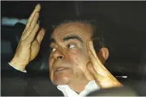  ?? REUTERS ?? FORMER NISSAN MOTOR CHAIRMAN Carlos Ghosn sits inside a car as he leaves his lawyer’s office after being released on bail from Tokyo Detention House, in Tokyo, Japan, March 6.