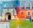  ?? ?? Police said the blaze at Malmesbury Abbey was started deliberate­ly in bins outside