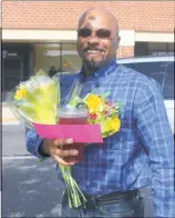  ?? STAFF PHOTOS BY TIFFANY WATSON ?? Nanjemoy resident John Swann received two bouquets of flowers at the Panera Bread in Waldorf on Oct. 19, one of which he planned to present to his daughter.