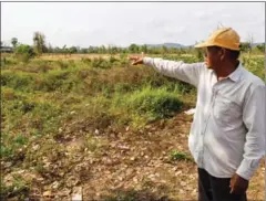  ?? ELIAH LILLIS ?? Lim Van points to the spot on his farm where he found human bones in Battambang province.