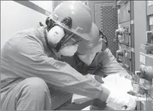  ?? PROVIDED TO CHINA DAILY ?? CNNC employees conduct maintenanc­e work at a nuclear power project in Zhangzhou, Fujian province.