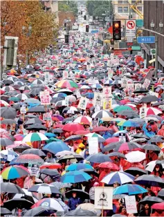  ??  ?? Some of the more than 30,000 striking teachers in the Los Angeles public school system march after holding a rally at the City Hall in Los Angeles. — Reuters photo