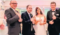  ??  ?? Couple Samantha Maher and Luke Davis with Roe Park Resort duty mangers Kevin Hunt (left) and Brian Lowney, who put their Hands That Talk sign language training into practice on the couple’s wedding day