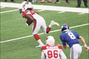  ?? Al Bello / Getty Images ?? Linebacker Markus Golden (44) of the Arizona Cardinals runs back a fumble by quarterbac­k Daniel Jones (8) of the New York Giants for 30 yards to the Giants’ 9-yard line in the first quarter of the game at MetLife Stadium on Sunday in East Rutherford, N.J.