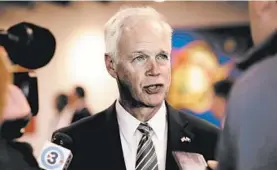  ?? AMBER ARNOLD/AP ?? U.S. Sen. Ron Johnson, R-Wis., speaks with members of the media in Madison, Wis., in October.