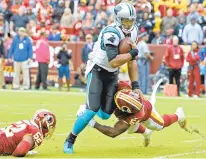  ?? JEFF SINER/TNS ?? Panthers star Cam Newton rushes for yardage as Redskins linebacker­s Ryan Anderson, left, and Mason Foster try to stop him Oct. 14.