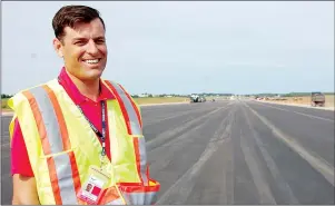  ?? JIM DAY/THE GUARDIAN ?? Doug Newson, CEO of the Charlottet­own Airport Authority, gives media a tour Thursday of the $7-million constructi­on project to extend the smaller of the airport’s two runways.