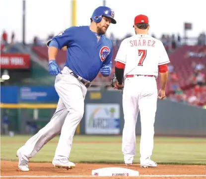  ??  ?? Left fielder Kyle Schwarber rounds the bases after hitting a three- run home run in the fourth inning. | JOHN MINCHILLO/ AP