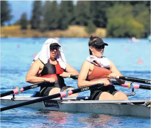  ??  ?? Life is but a dream . . . In searing heat, the North End crew of Bridget McArthur and Kate Pitcaithly head to the start of the women’s double sculls race during the Canterbury Rowing Championsh­ips on Lake Ruataniwha at the weekend. Right: Otago Boys’ High School pupils Archie Chittock and Ryan Eagan give it everything in the under15 boys double sculls.