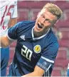  ??  ?? Ross McCrorie shows his frustratio­n after volleying a rare chance over the England bar.
