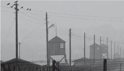  ?? Associated Press ?? In this Nov. 9, 2005, file photo, watch towers and the barbed wire fence of the former Nazi death camp Majdanek are photograph­ed outside the city of Lublin in eastern Poland. German prosecutor­s say on Friday they have charged a former guard at the...