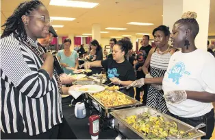  ?? PHOTOS: THOMSON REUTERS FOUNDATION ?? Feeding the people . . . Marie Kidhe serves breakfast at the Seattle Black Panthers Party 50th anniversar­y celebratio­n in April.