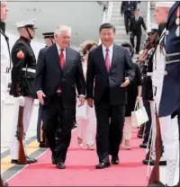  ?? LAN HONGGUANG / XINHUA ?? President Xi Jinping and his wife Peng Liyuan are greeted by US Secretary of State Rex Tillerson and his wife Renda St. Clair upon arriving at Palm Beach Internatio­nal Airport in West Palm Beach on Thursday.
