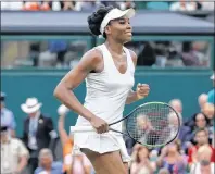  ?? AP PHOTO ?? Venus Williams of the United States celebrates after beating Latvia’s Jelena Ostapenko at the end of their Women’s Quarterfin­al Singles Match on day eight at the Wimbledon Tennis Championsh­ips in London Tuesday.