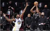  ?? KATHY WILLENS — THE ASSOCIATED PRESS ?? Warriors center James Wiseman (33) defends as Nets forward Kevin Durant (7) looks to shoot during the first quarter on Tuesday in New York.