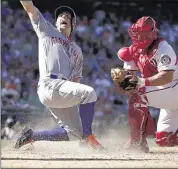  ?? ALEX BRANDON/ASSOCIATED PRESS ?? David Wright celebrates as he scores for the Mets against Washington and catcher Wilson Ramos Monday.